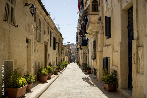 Fototapeta Naklejka Na Ścianę i Meble -  A quaint narrow street in Valletta, Malta