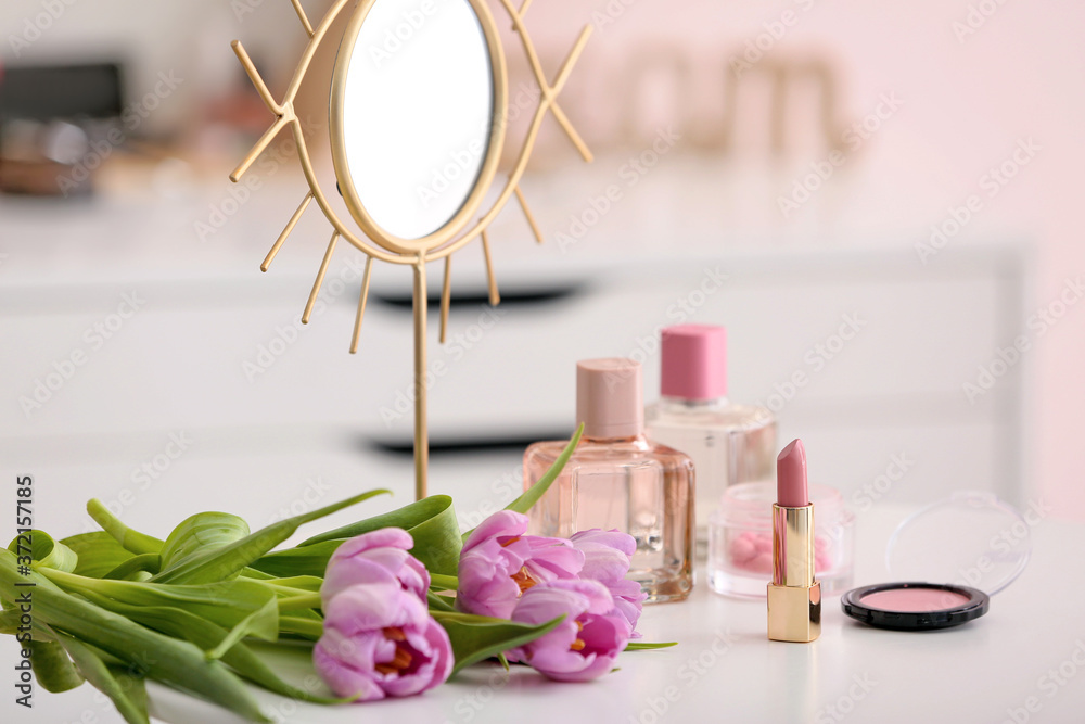 Makeup cosmetics on table in dressing room Makeup cosmetics on table in dressing room