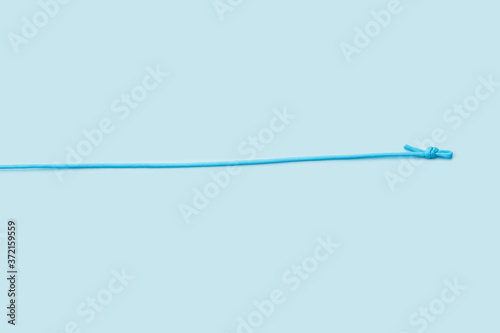 Long rope on color background