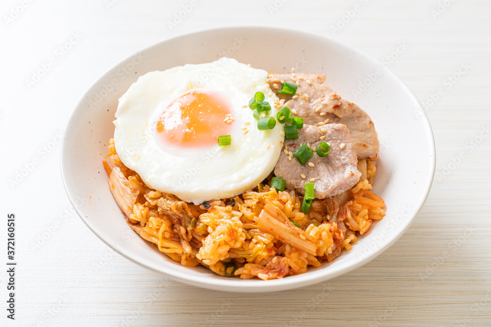 Kimchi fried rice with fried egg and pork Kimchi fried rice with fried egg and pork