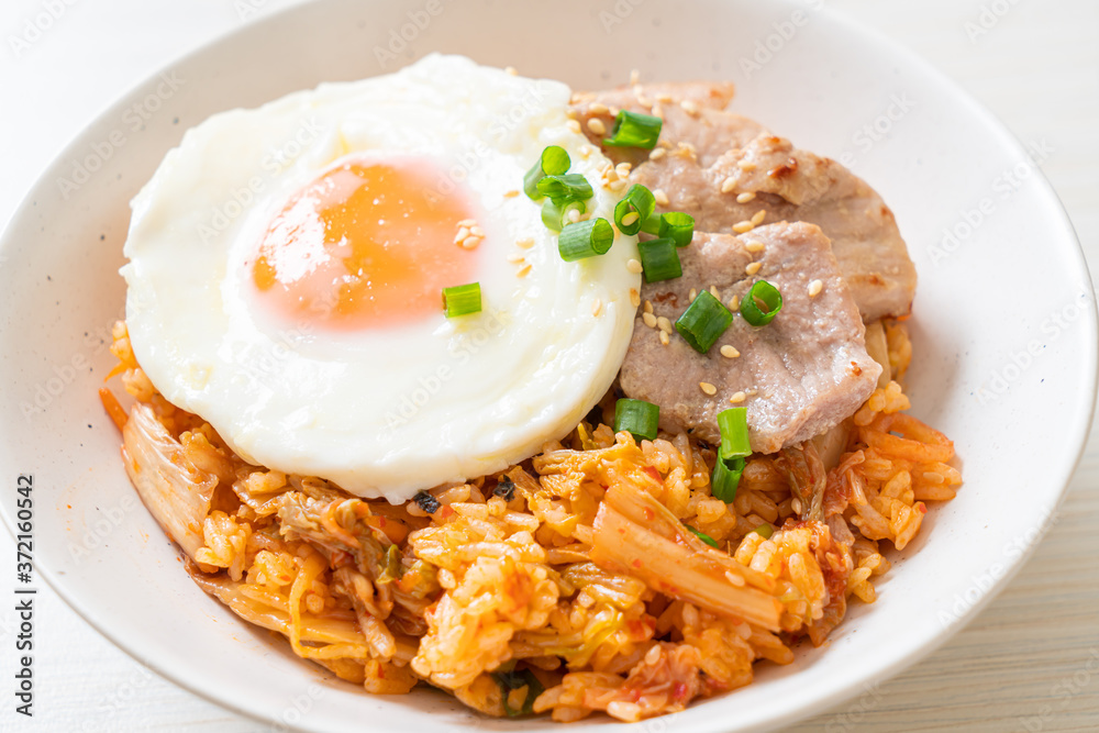 Kimchi fried rice with fried egg and pork Kimchi fried rice with fried egg and pork
