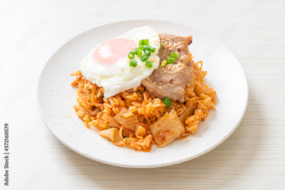 Kimchi fried rice with fried egg and pork Kimchi fried rice with fried egg and pork