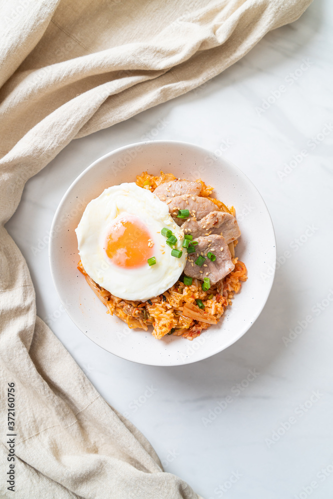Kimchi fried rice with fried egg and pork Kimchi fried rice with fried egg and pork