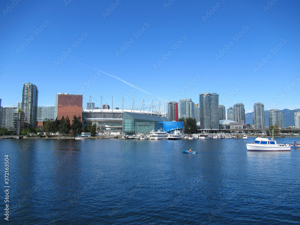 BC Place stadium, sea bay, houses and boats in Vancouver at summer.