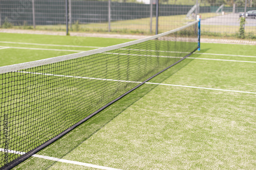 Tennis net and court. Playing Tennis. Healthy lifestyle