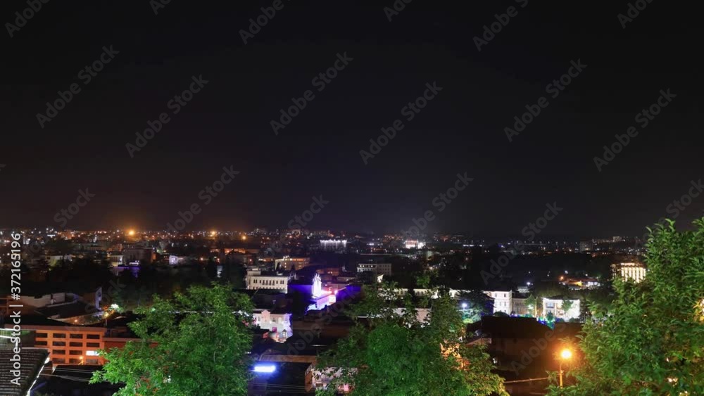 timelapse with Panoramic summer view of the city of Kutaisi, Georgia. River Rioni and old houses with Red roofs. night thunderstorm over Kutaisi and Mountains in the distance. timelapse with Panoramic summer view of the city of Kutaisi, Georgia. River Rioni and old houses with Red roofs. night thunderstorm over Kutaisi and Mountains in the distance.
