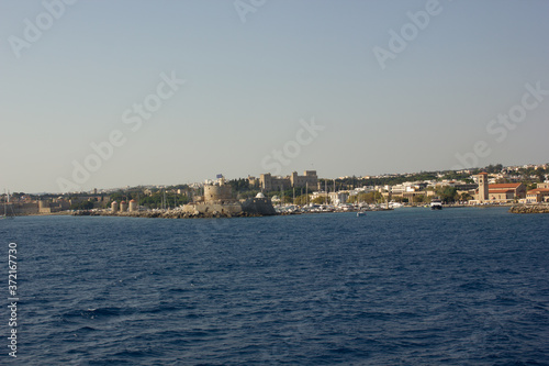Greece. Rhodes island. Rest at the sea. Euro-trip. Sea water surface. Mountains in the background. © andreswestrum