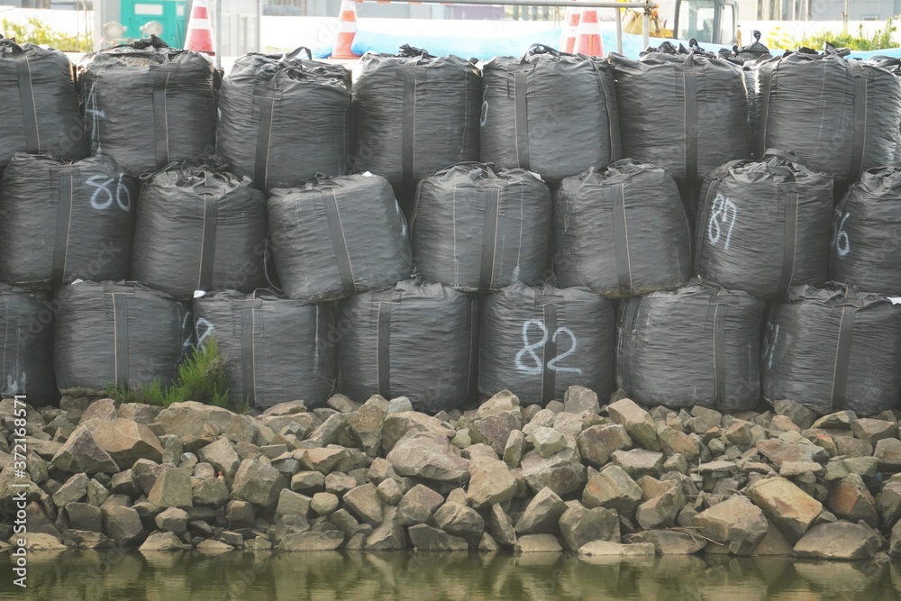 復興工事現場の土のう/Sandbags at reconstruction site of river 復興工事現場の土のう/Sandbags at reconstruction site of river