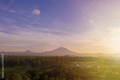 Sunrise landscape on Bali island. View of mountains, Ubud village, rice fields.