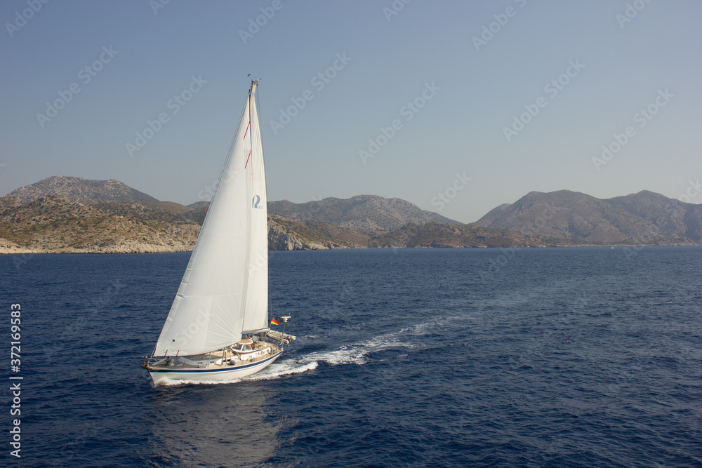 Obraz premium Greece. Rhodes island. Rest at the sea. Euro-trip. Sea water surface. Boats.
