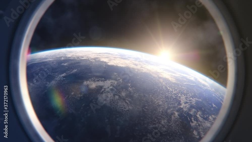 Breathtaking View of the Planet Earth from International Space Station Porthole. Rising Sun Illuminates Our Blue Planet's Clouds, Oceans and Peaceful Cities. Scientifically Accurate 3D VFX Rendering photo