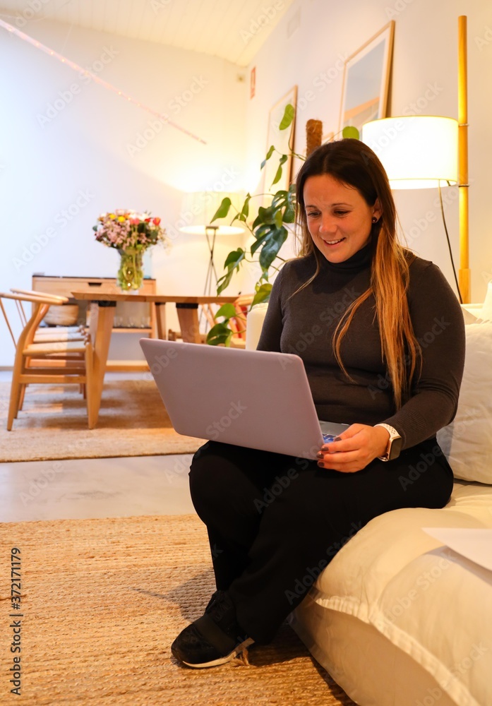 Hotel manager working with laptop on the sofa. Hotel manager working with laptop on the sofa.