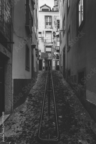 Vertical view of narrow old alleyways of Alfama neighborhood in Lisbon  Portugal