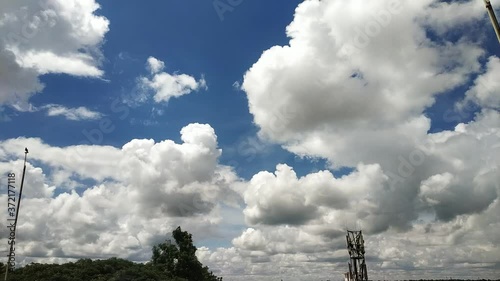 Time lapse video motion of moving clouds with blue sky color.