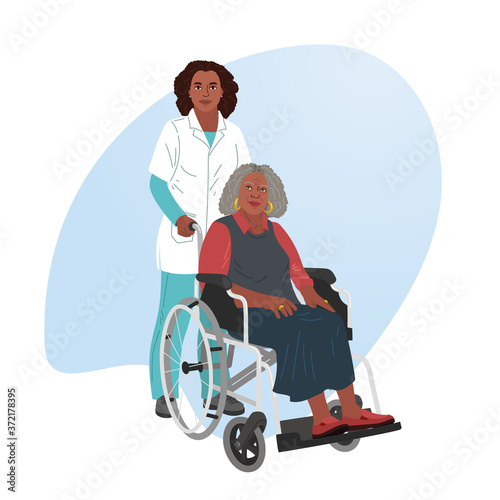 A girl nurse rolls a wheelchair with a patient. Disabled man.