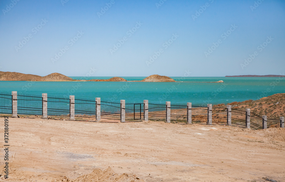 Mynaral/Kazakhstan:  View on Balkhash lake shore and islands behind the fence. From new house for Jambyl Cement plant staff.