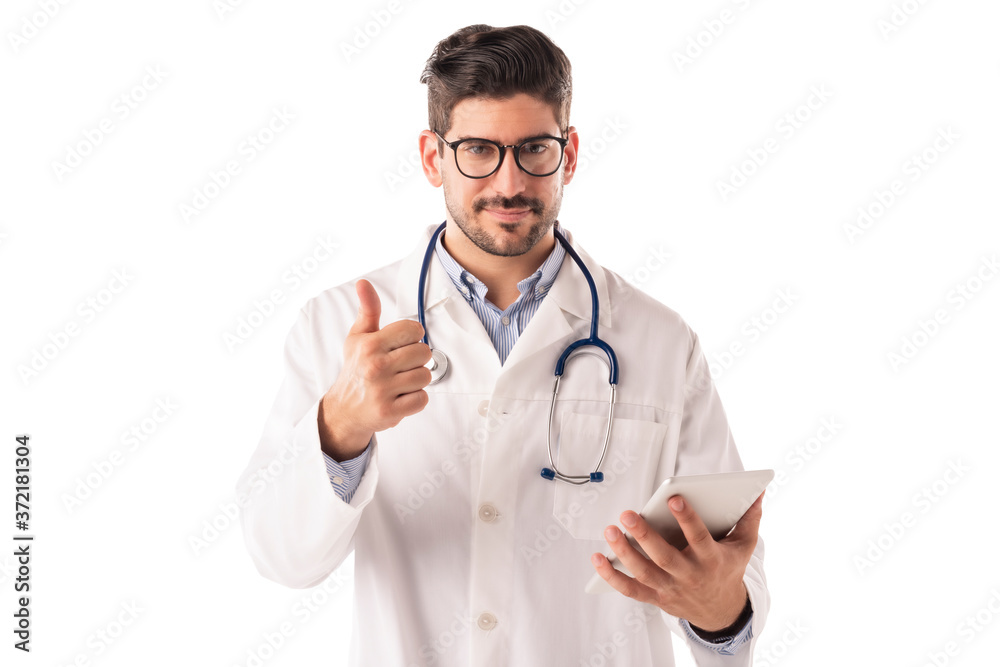 Male doctor giving thumbs up while standing at isolated background Male doctor giving thumbs up while standing at isolated background