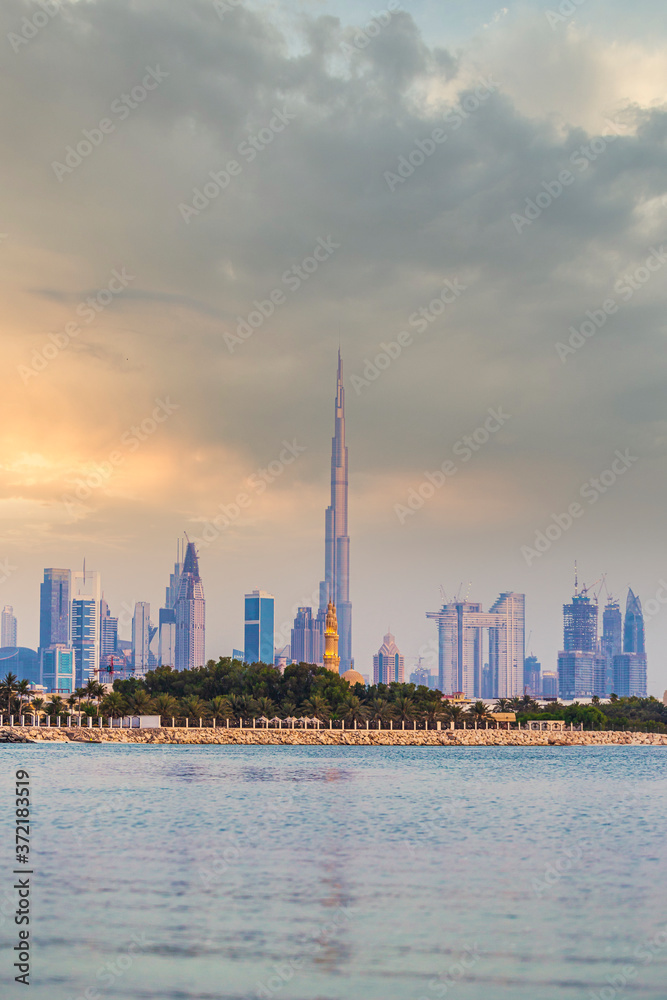 Dubai skyline lakeview during cloudy sunset