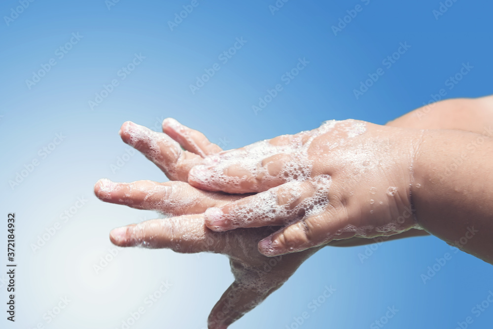 Fototapeta premium Cleaning and washing hands with soap prevention for outbreak of corona virus covid-19. Corona virus or COVID-19 pandemic prevention