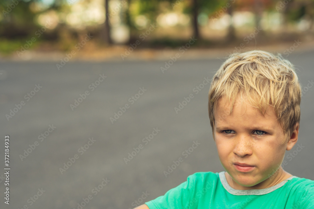 Portrait handsome cute serious sad blond boy in bad mood look away. Artistic emotions. Problem or happy childhood, behaviour education psychology, family relationship concept