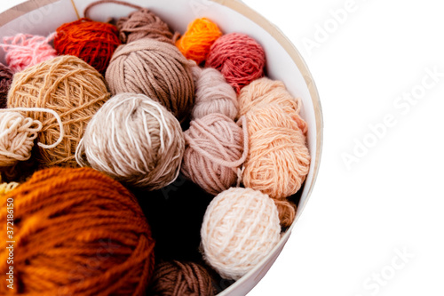 Colorful Balls of wool with knitting needles on white background,hobby and free time concept. Yarns for knitting copyspace