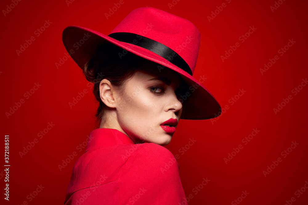 woman in red shirt with bright makeup and hat on her head emotions fashion style woman in red shirt with bright makeup and hat on her head emotions fashion style