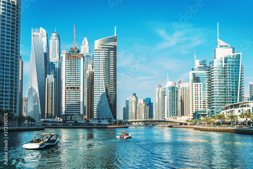Panorama of Dubai Marina in UAE, modern skyscrapers and port with luxury yachts. © DedMityay