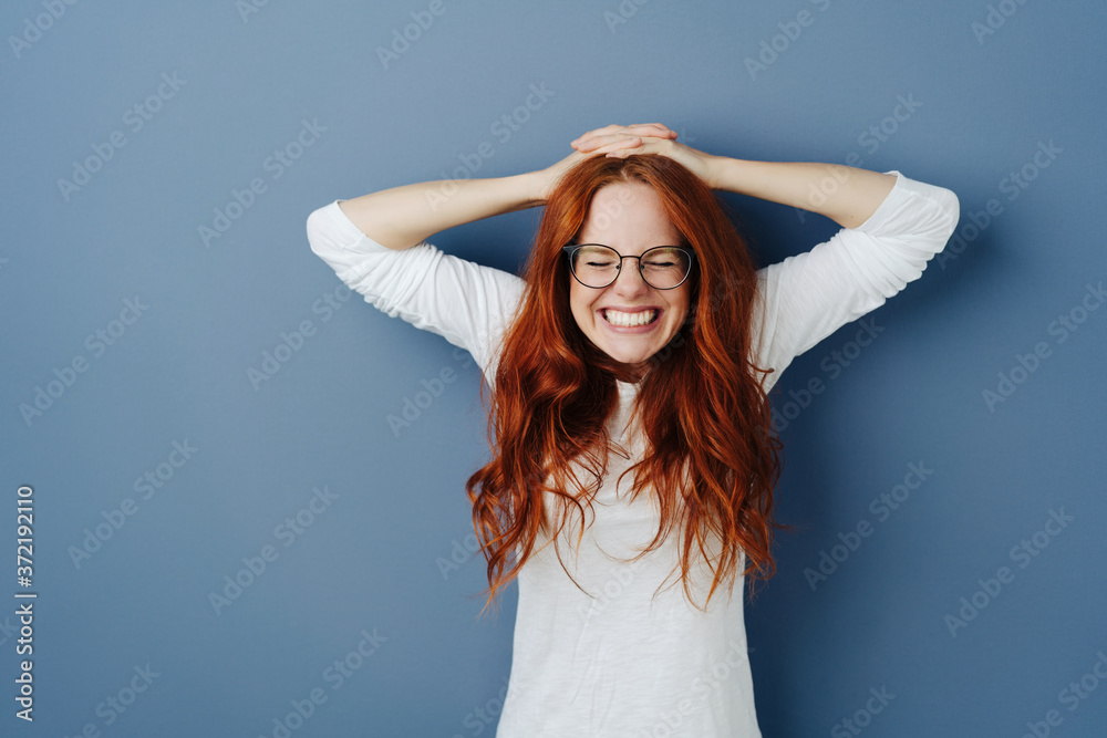 Pretty young redhead woman pulling a funny face Pretty young redhead woman pulling a funny face