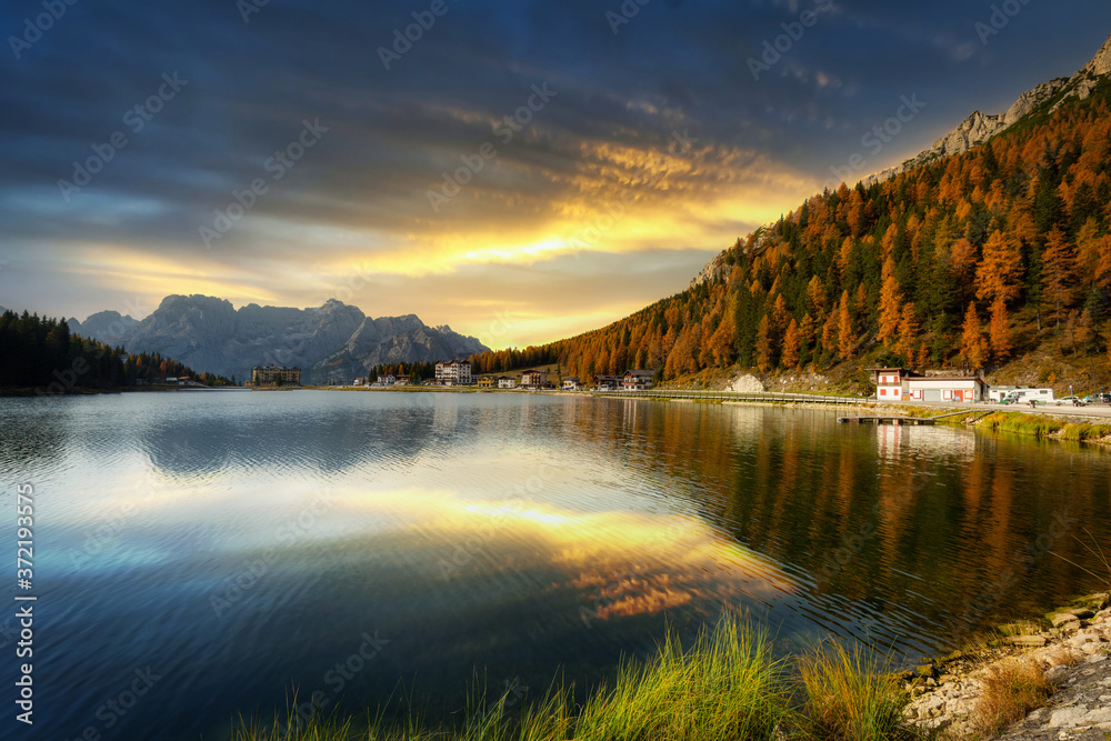 Fototapeta premium Dolomites mountains reflected in the Lago mi Misurina Lake at sunset, South Tyrol. Italy
