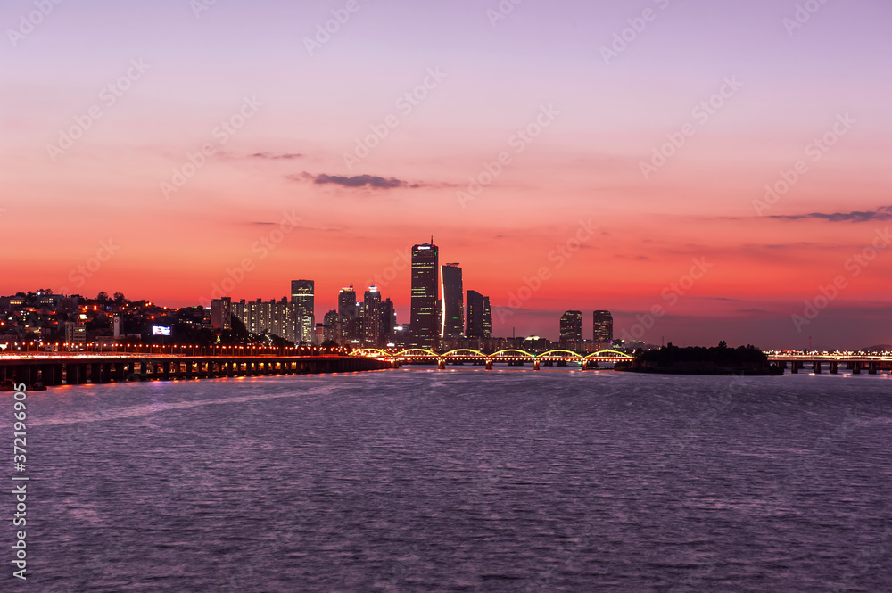 The fantastic and wonderful sunset background blue sky and orange color clouds.