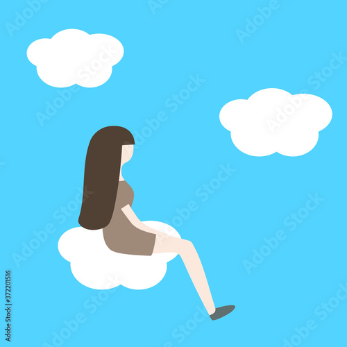 Young woman sitting on a cloud in the sky photo
