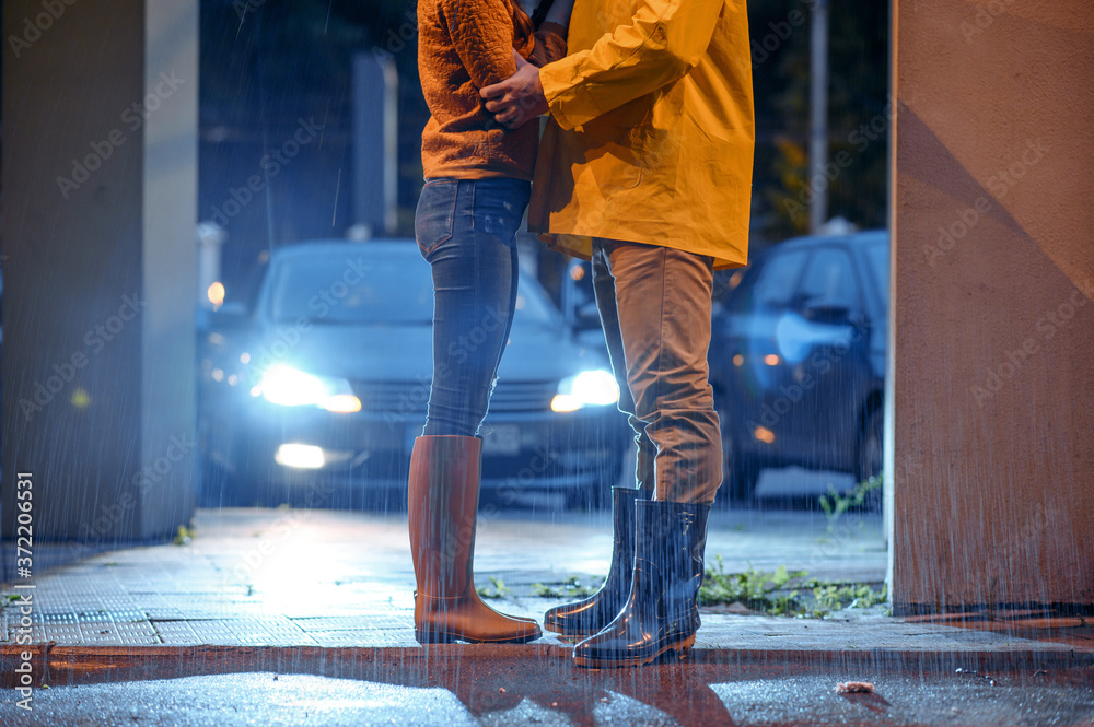 Love couple dating in night park, summer rainy day