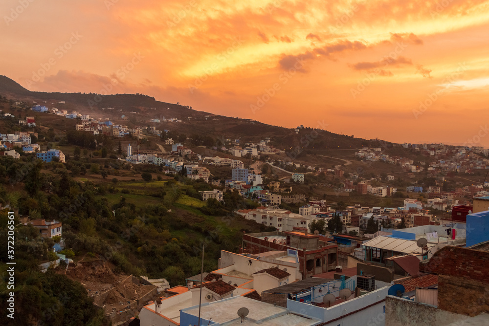Sunset sky at the Chefchaouen city with traditional blue houses, Morocco