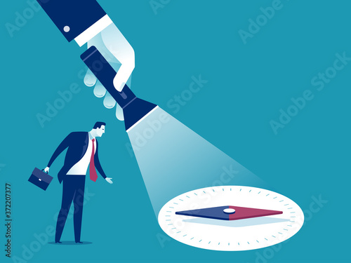 Uncovering direction. A hand holding a flashlight uncovering hidden compas. Business vector illustration.