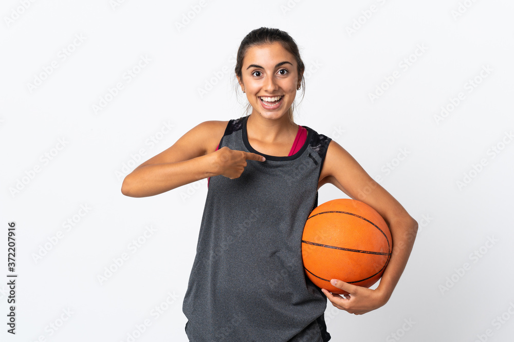 Young hispanic woman playing basketball over isolated white background with surprise facial expression