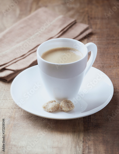 Cup of coffee on wooden background. Copy space. 