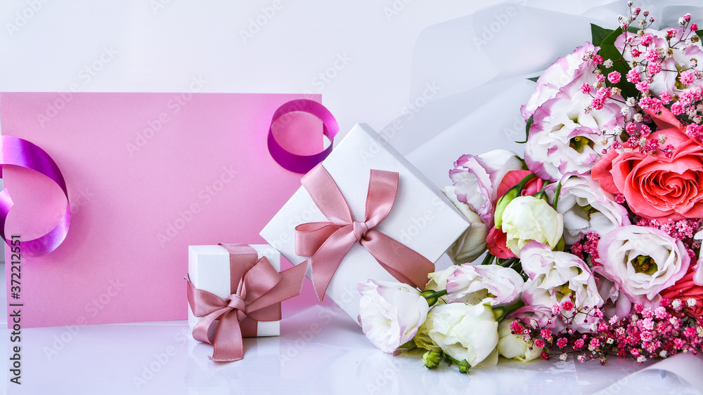 card mockup with delicate bouquet and gift boxes. floral background. Top view Flat lay Holiday card 8 March, Happy Valentine's day, Mother's day concept. Copy space - obrazy, fototapety, plakaty 