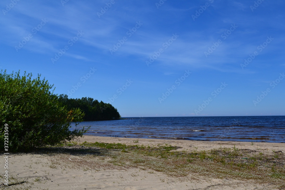 sandy shore of the Northern lake on a Sunny day sandy shore of the Northern lake on a Sunny day