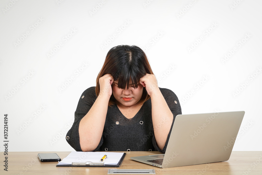 Fat Asian women sitting stressful work. Concept of illness at work Fat Asian women sitting stressful work. Concept of illness at work