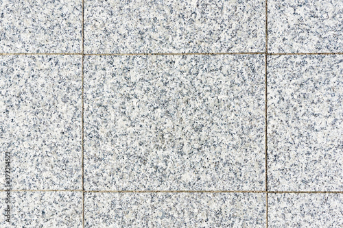 Mineral grain texture. Distressed noise pattern. Marble background. Flat granite surface. Macro effect structure for graphic design. Pavement blocks top view.