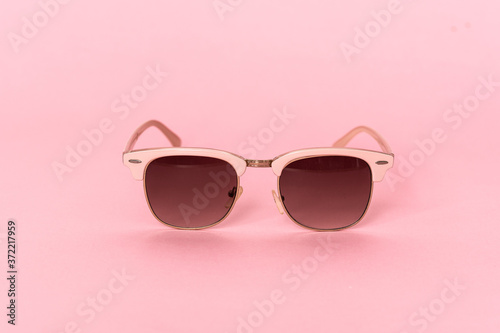 pink sunglasses isolated on white © luismolinero