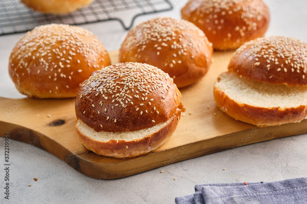 Fresh homemade burger buns with sesame. Copy space. Fresh homemade burger buns with sesame. Copy space.