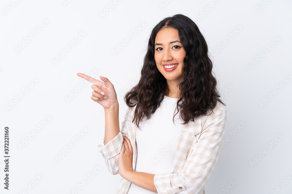 Mixed race woman over isolated white background pointing finger to the side Mixed race woman over isolated white background pointing finger to the side
