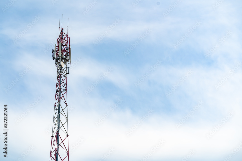 Telecommunication tower of 4G and 5G cellular. Macro Base Station. Wireless Communication Antenna Transmitter. Telecommunication steel high tower with antennas against blue sky. Telecommunication tower of 4G and 5G cellular. Macro Base Station. Wireless Communication Antenna Transmitter. Telecommunication steel high tower with antennas against blue sky.