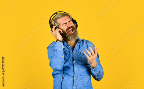 Music beat. Man bearded hipster headphones listening music. Dj hipster. Excellent music playlist. Hipster enjoy excellent sound song in earphones. Rhythm concept. Noise cancellation function