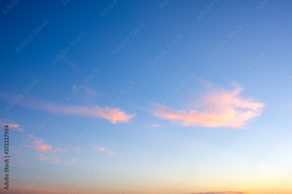 The sky at sunset. Blue and pink sky with clouds