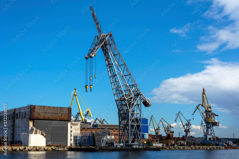 Saint Petersburg, floating crane on a pier in an industrial zone