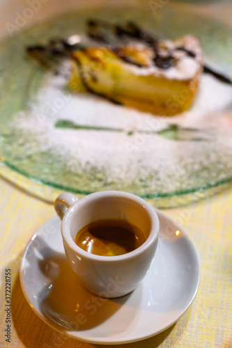 Classic italian espresso coffee served with homemade apple cheese cake with chocolate