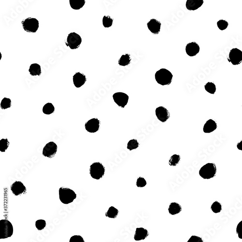 Grunge spots hand drawn vector seamless pattern. Ink dirty circles texture. Black paint dry brush splodges, blotches background. Abstract rough blots, splotches backdrop. Wrapping paper design.