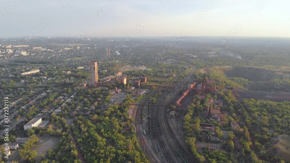 City mine and quarry red iron ore headframe aerial drone right side panorama camera movement Krivoy Rog Ukraine City mine and quarry red iron ore headframe aerial drone right side panorama camera movement Krivoy Rog Ukraine